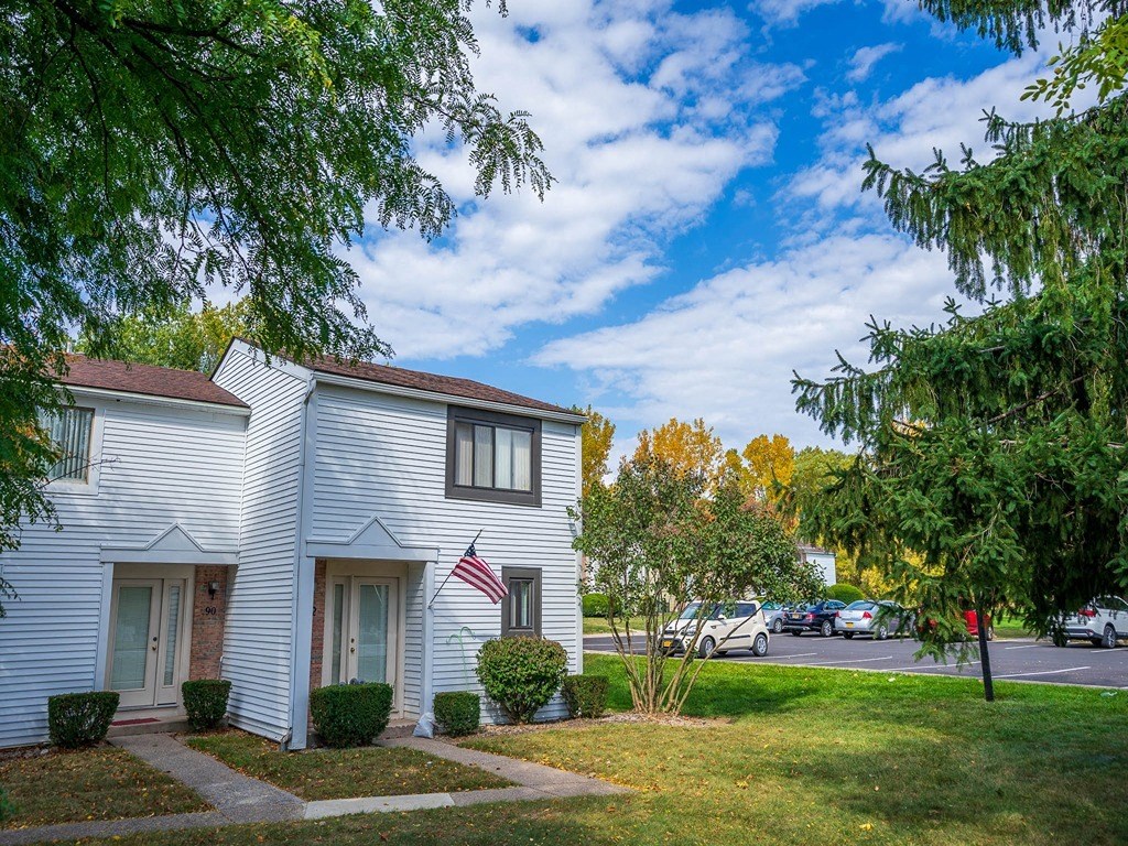 a white building with an flag on the side of it