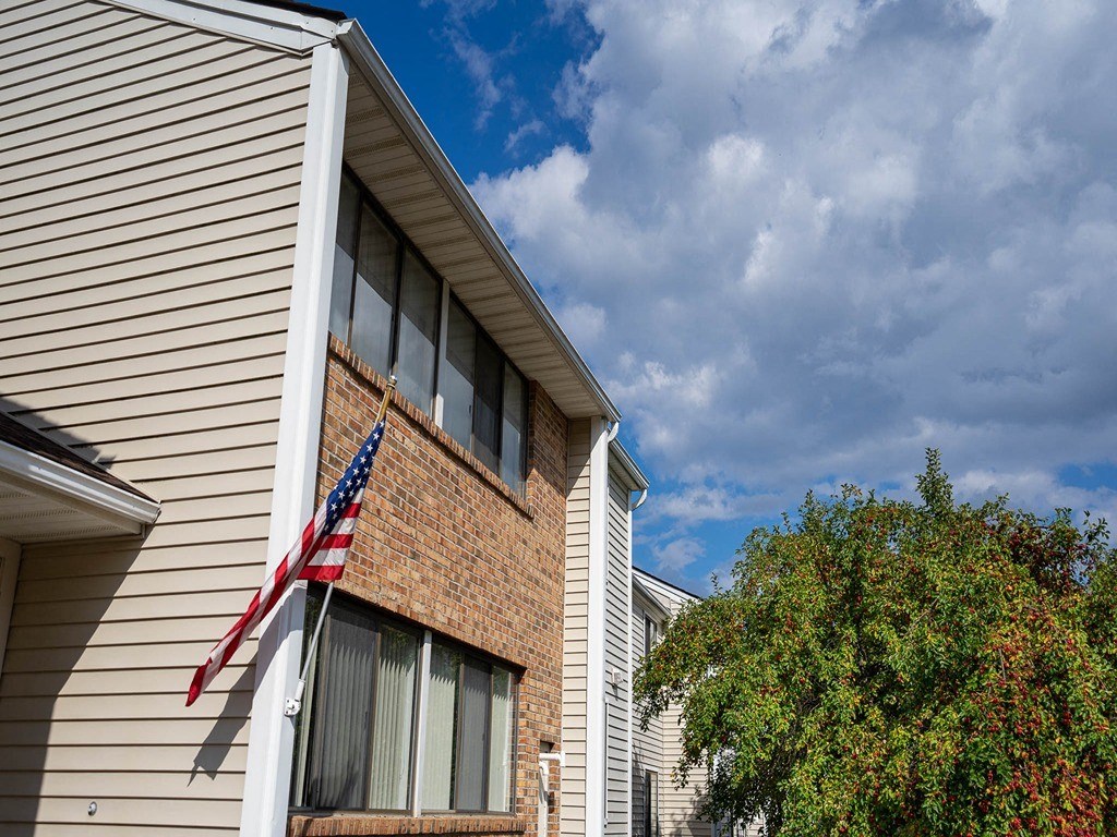 an flag hanging on the side of a building