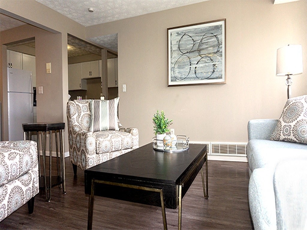 a living room with couches and a coffee table