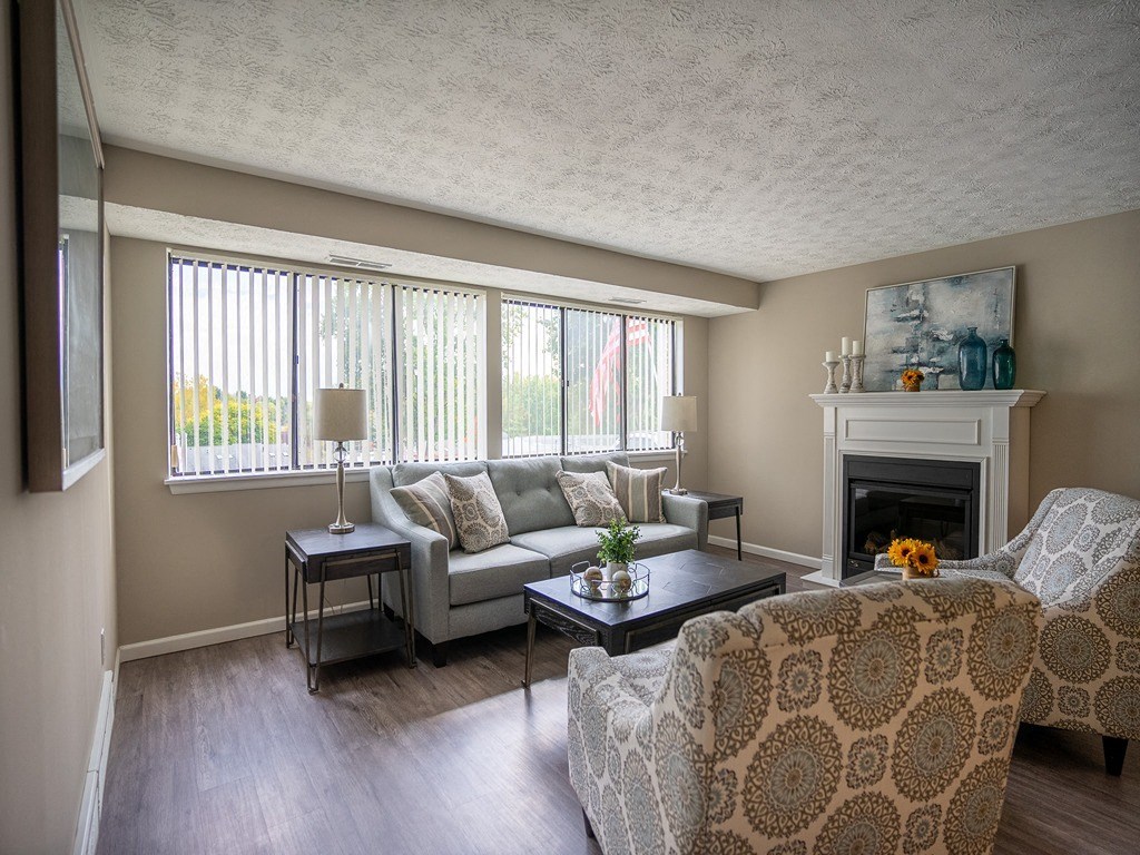 a living room with a couch and a fireplace