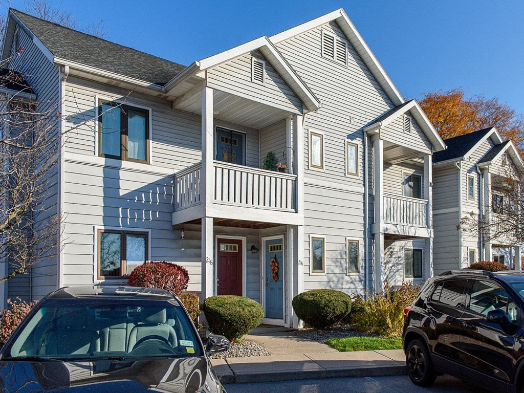 a house with cars parked in front of it