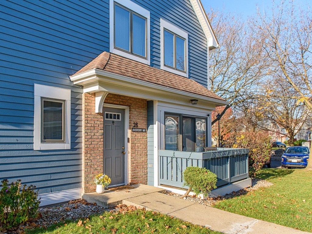 a blue house with a porch and a blue door