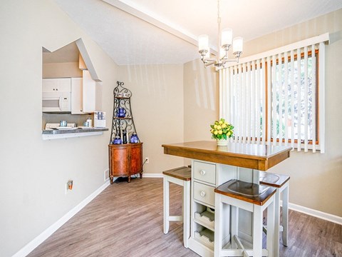 a kitchen with a table and a counter top
