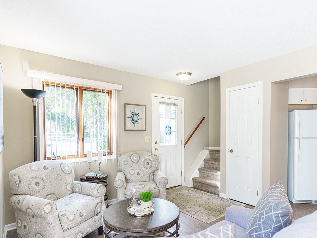 a living room with two chairs and a table
