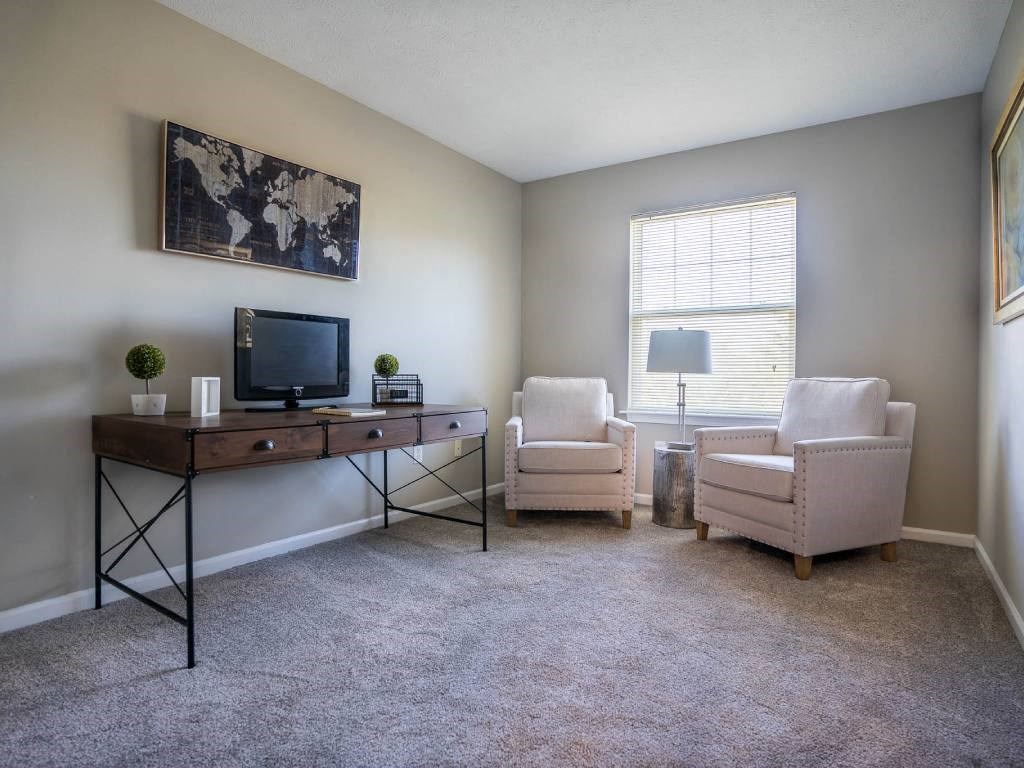 Interior view of second bedroom styled as a home office