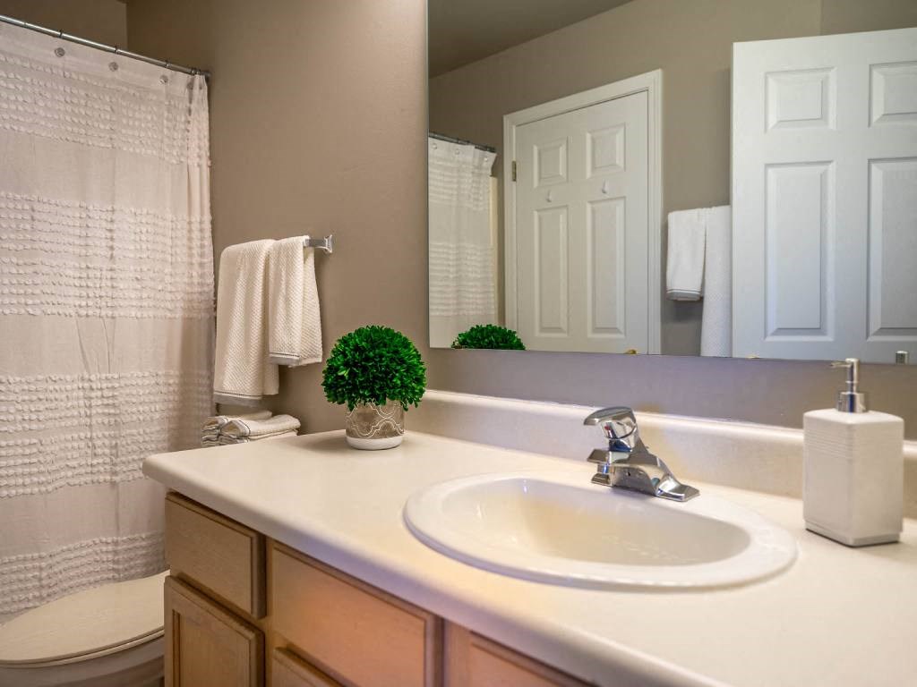 Interior view of full bathroom with tub/shower combo