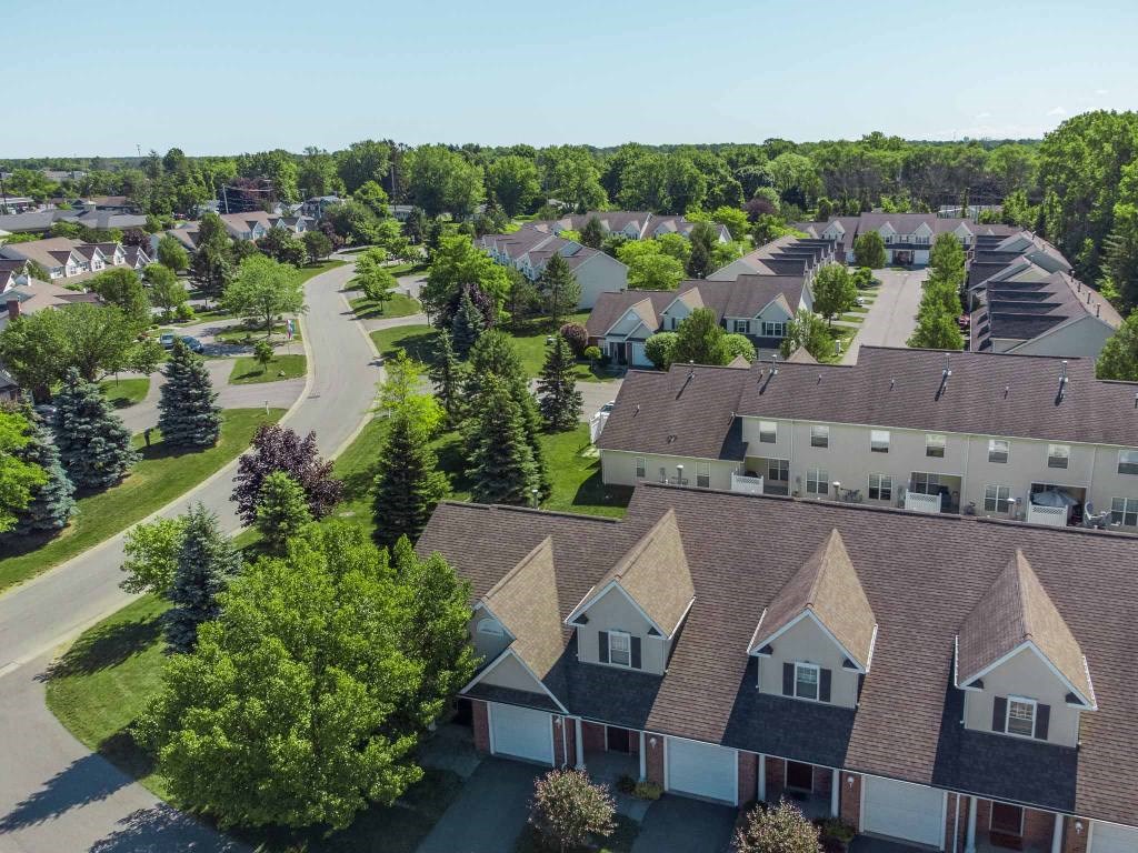 Exterior aerial view of Webster Woods townhomes neighborhood looking east