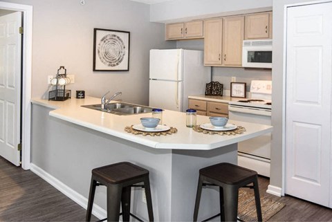 a kitchen with a counter top and a sink