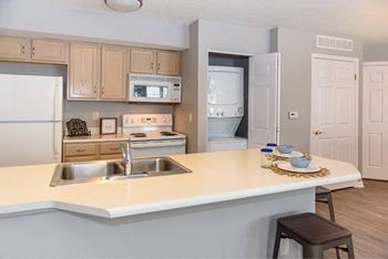 a kitchen with a counter top and a sink