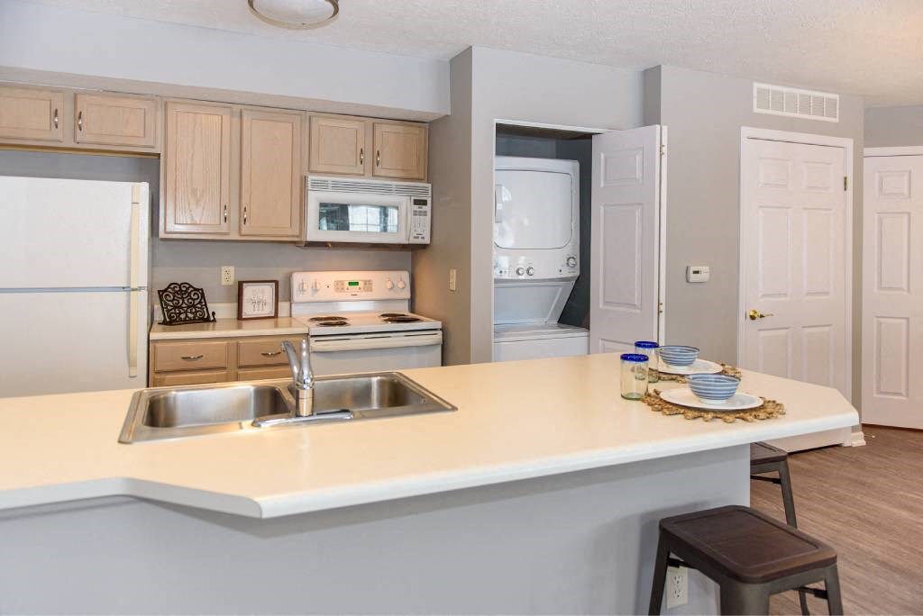 a kitchen with a counter top and a sink