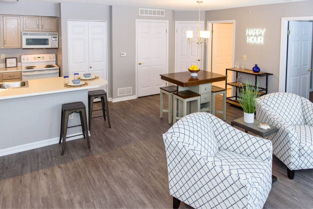 a living room and kitchen with an open floor plan