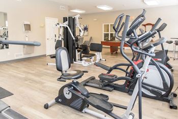 the gym is equipped with a variety of exercise equipment