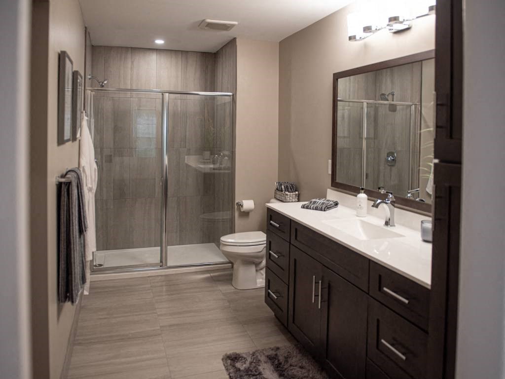 Interior view of Champion Reserve Townhomes primary bathroom with step-in shower.