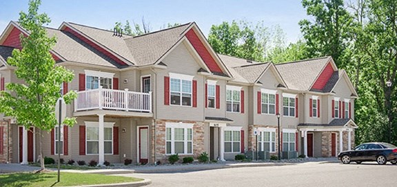 Typical apartment building showing entrances, covered porches, and balconies near convenient parking