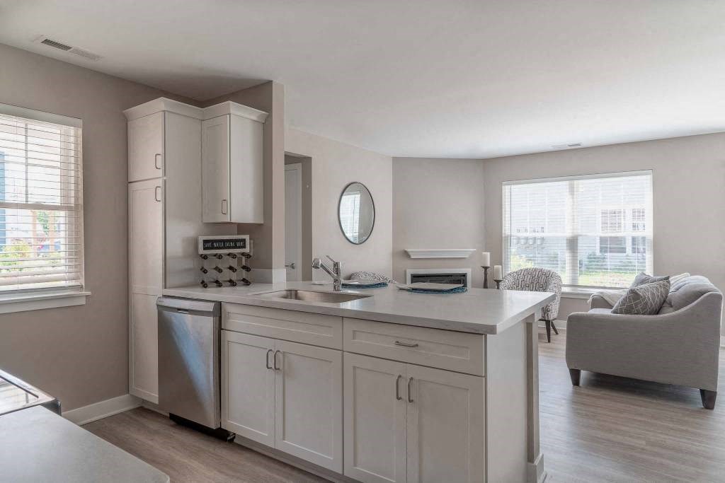 a kitchen with white cabinets and a sink