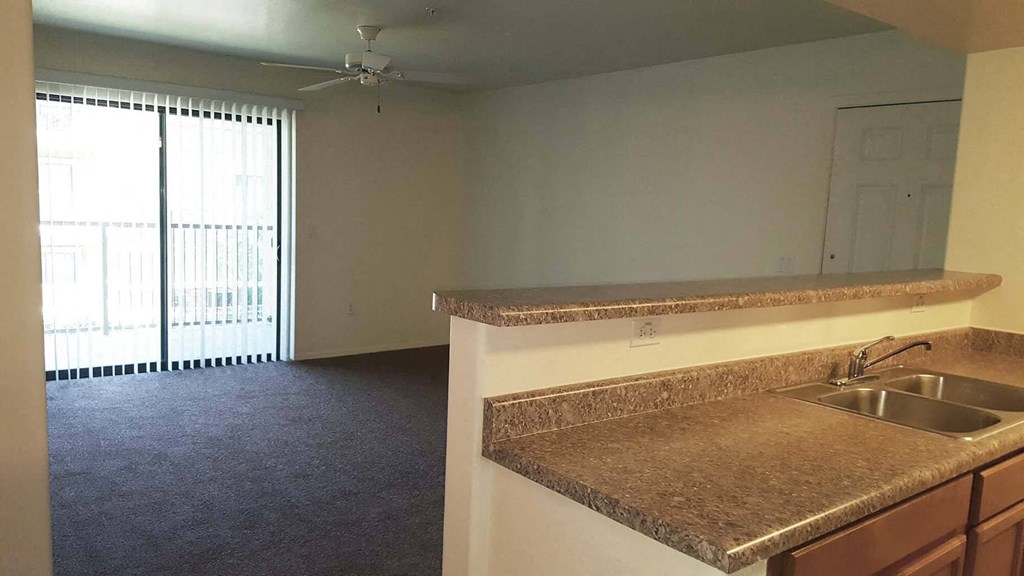Rehoboth Place apartments in Phoenix, AZ kitchen counter and living room
