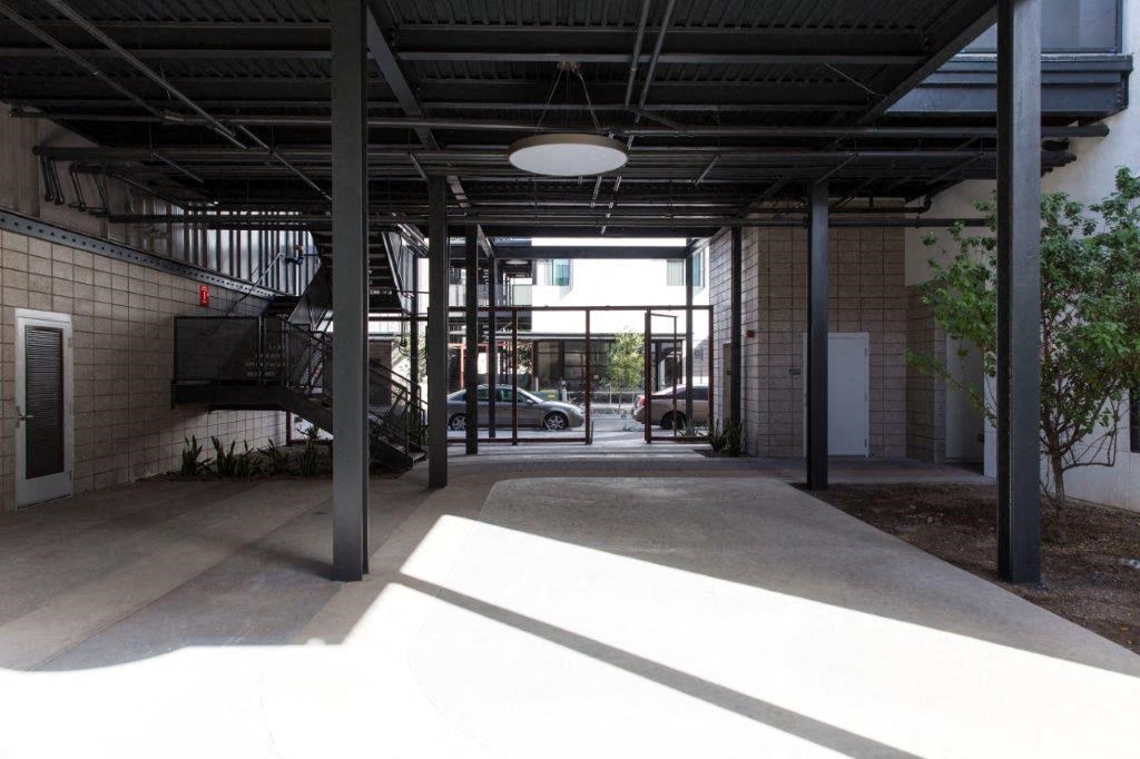 an empty building with a lobby and a staircase