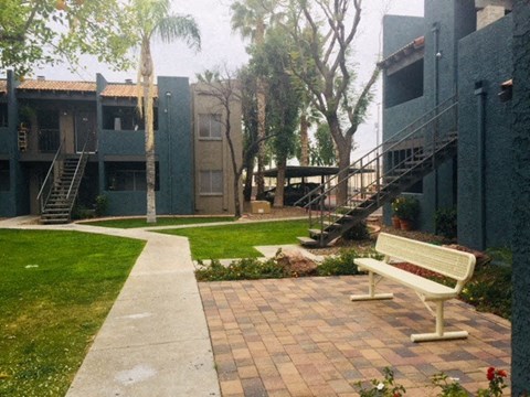 a bench sitting in front of a building