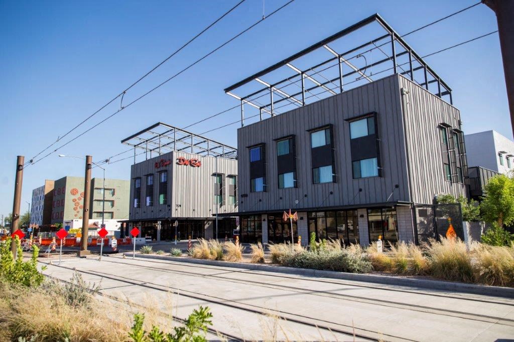 a building that is sitting on the side of the tracks