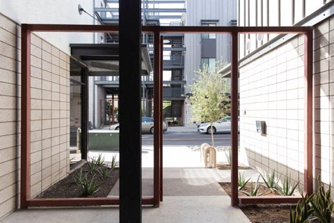 a view of the entrance to a building with glass doors