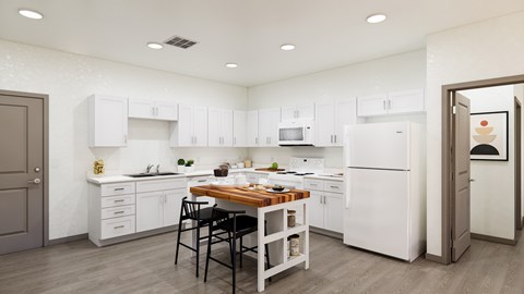 A kitchen with white cabinets and a wooden island.