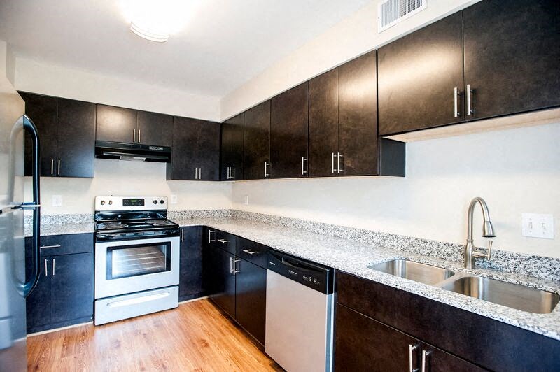 a kitchen with a stove and a sink