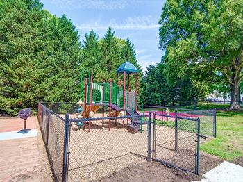 a playground with a slide and other playground equipment