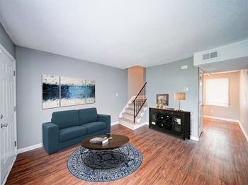 a living room with a couch and a table
