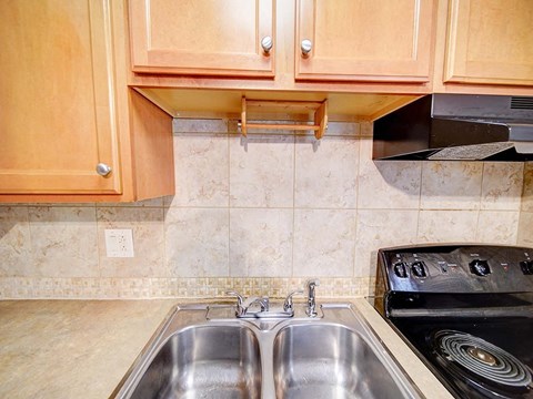 a kitchen with a sink and a stove
