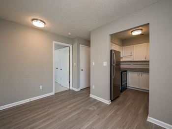 a renovated kitchen with a stainless steel refrigerator