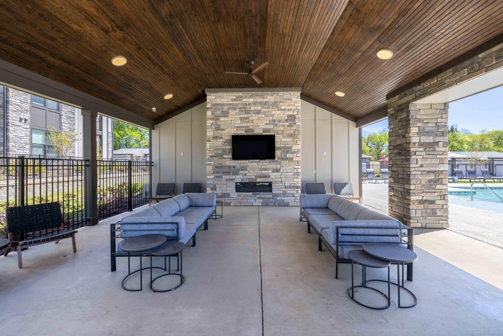 Outdoor Lounge With TV at Evolve at Parkway Apartment Homes, Concord