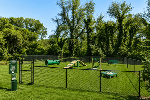 A playground with a green slide and a sign that says "DO NOT PICK".