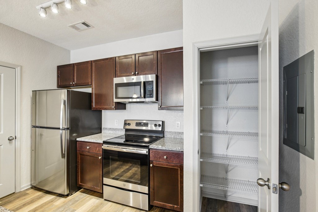 A kitchen with a refrigerator, oven, and microwave at Venue at 109 Apartments, Tennessee, 37090