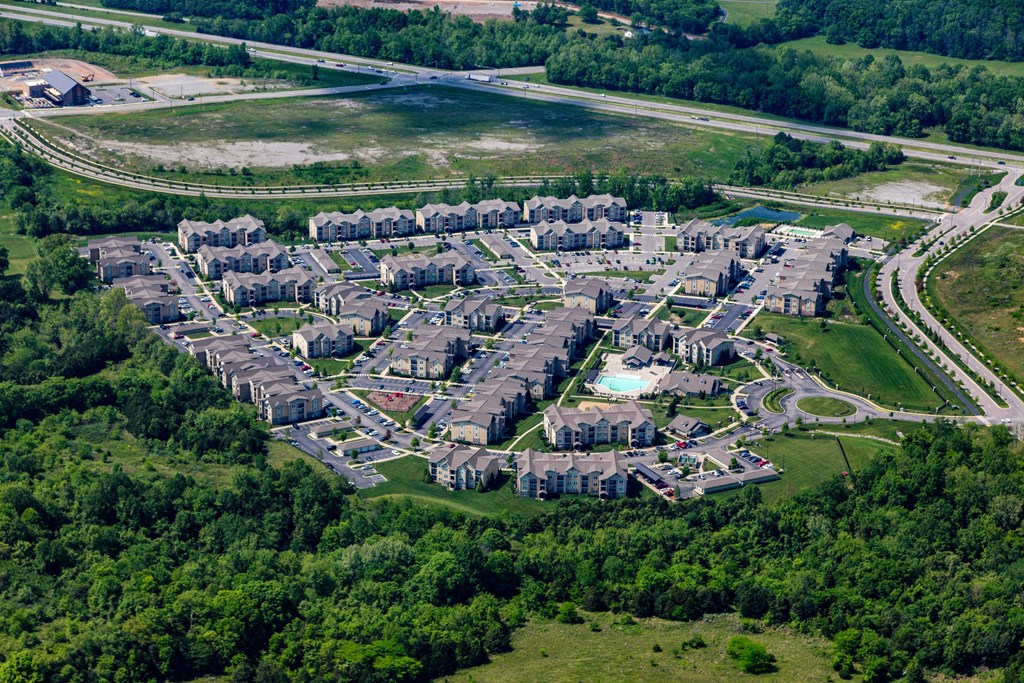 A bird's eye view of a residential area with houses and a swimming pool at Venue at 109 Apartments, Lebanon  37090