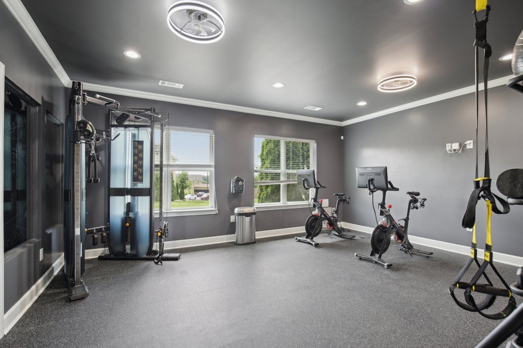 A spacious home gym with a variety of exercise equipment at Venue at 109 Apartments, Lebanon , TN, 37090