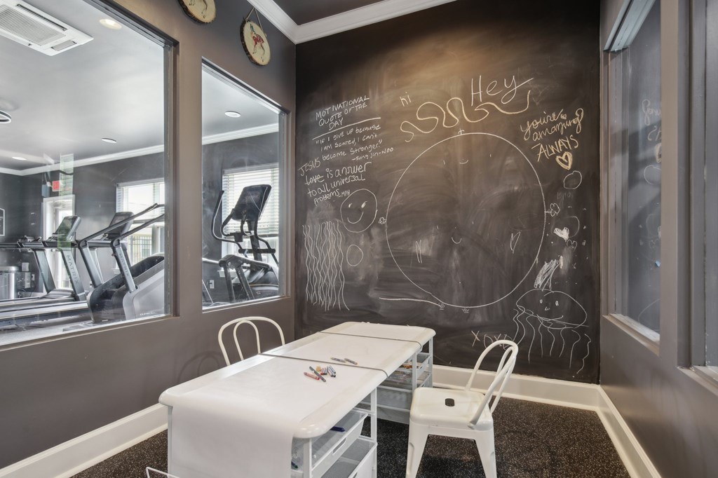 A chalkboard wall in a room with a table and chairs at Venue at 109 Apartments, Lebanon , TN