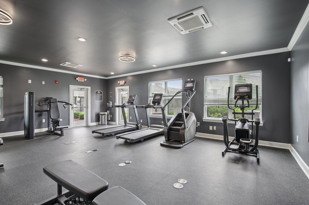 A spacious gym with a variety of equipment including treadmills, elliptical machines, and weight machines at Venue at 109 Apartments, Lebanon , Tennessee