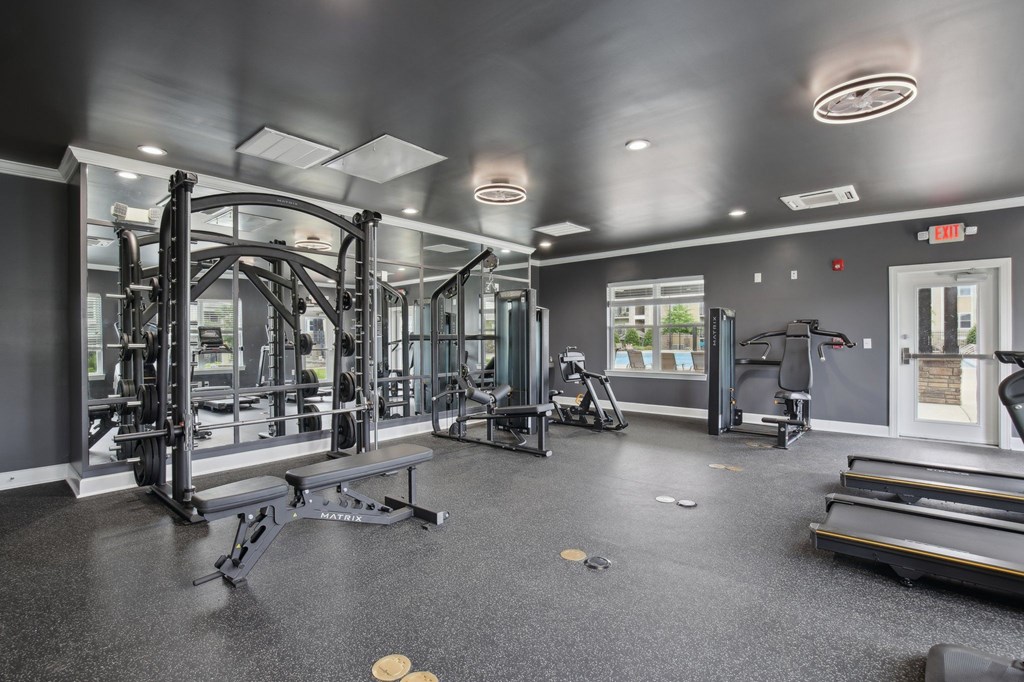 A spacious gym with a variety of equipment including treadmills, weights, and exercise machines at Venue at 109 Apartments, Tennessee
