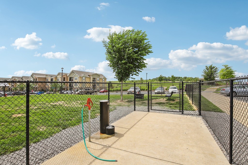 A playground with a swing set and a fence at Venue at 109 Apartments, Lebanon , TN