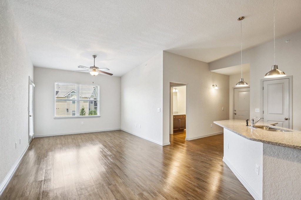 A spacious room with wooden floors and a ceiling fan at Venue at 109 Apartments, Tennessee
