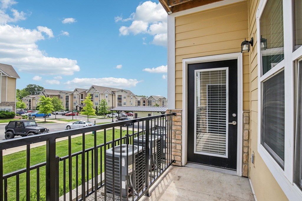 A view from a balcony of a house with a black railing and a black door at Venue at 109 Apartments, Tennessee, 37090