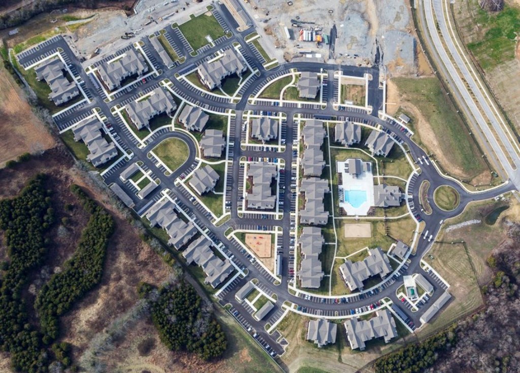 A bird's eye view of a residential area with a roundabout in the center. at Venue at 109 Apartments, Lebanon 