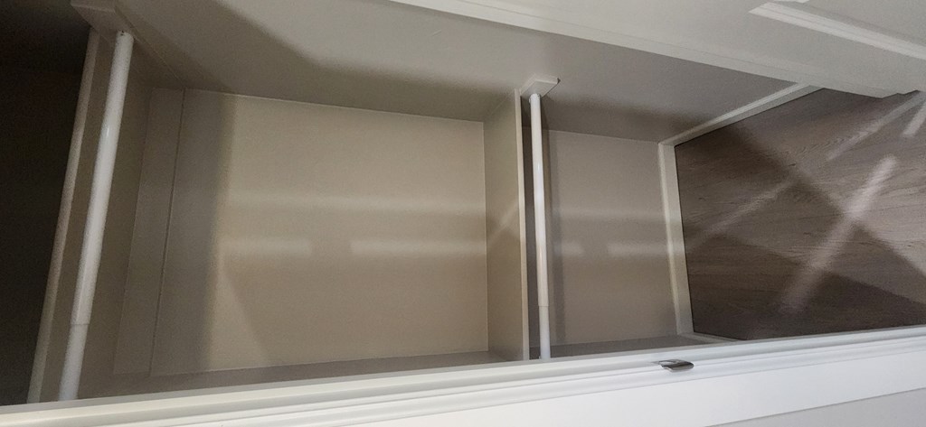 A white closet with the door open.