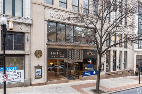 A building with a sign that says "Lancaster New York" on it.