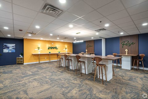 A room with a long table and chairs.