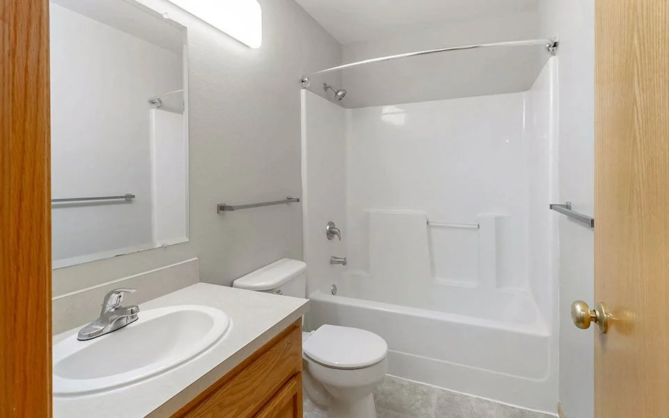 a bathroom with a sink toilet and a shower