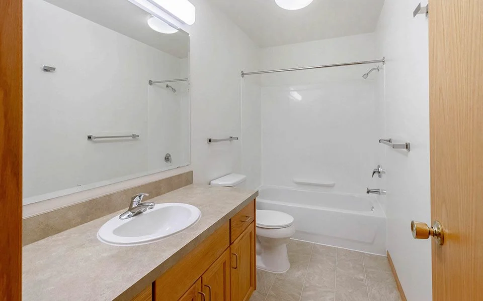 a bathroom with a sink toilet and a shower