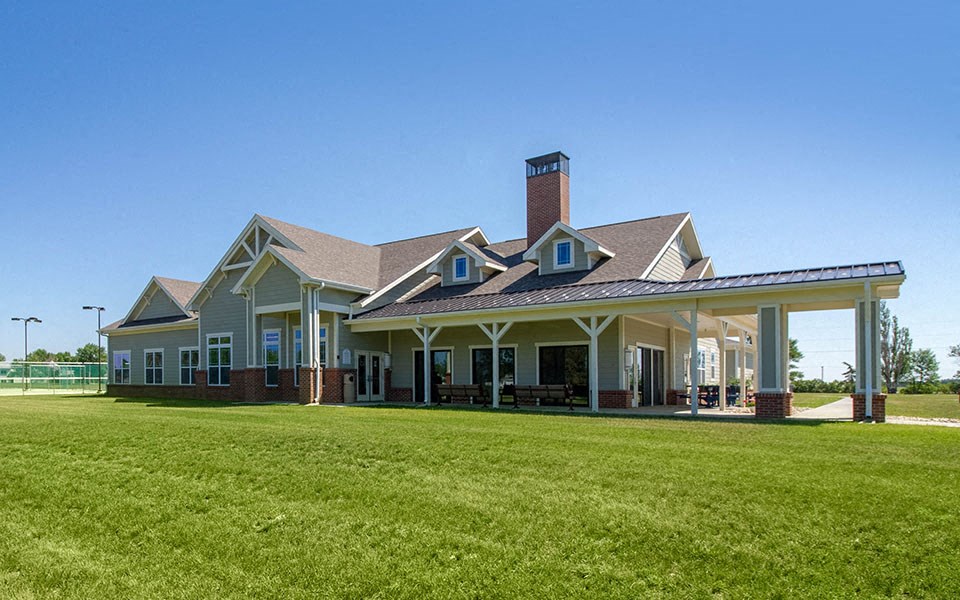 a large house with a lawn in front of it