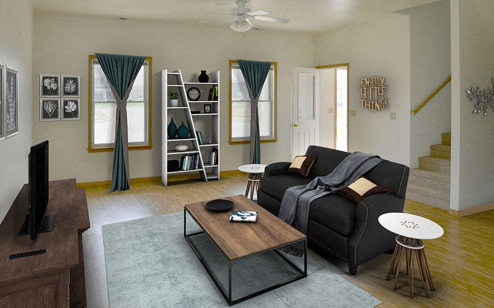 a living room with a black couch and a coffee table