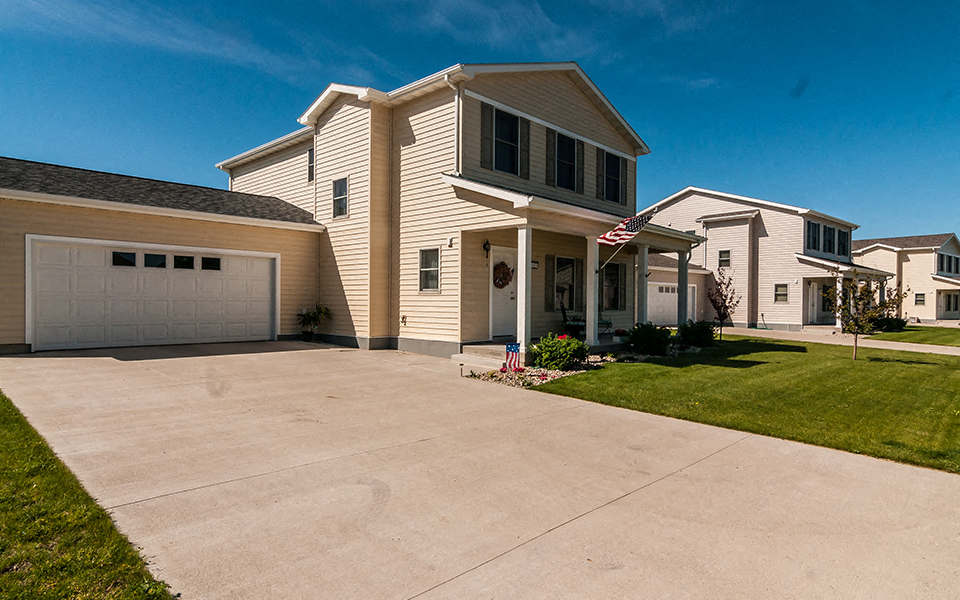 a house with a driveway and a garage door